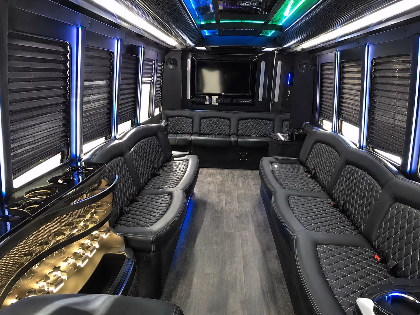 Friends laughing during a party bus celebration in Miami Gardens