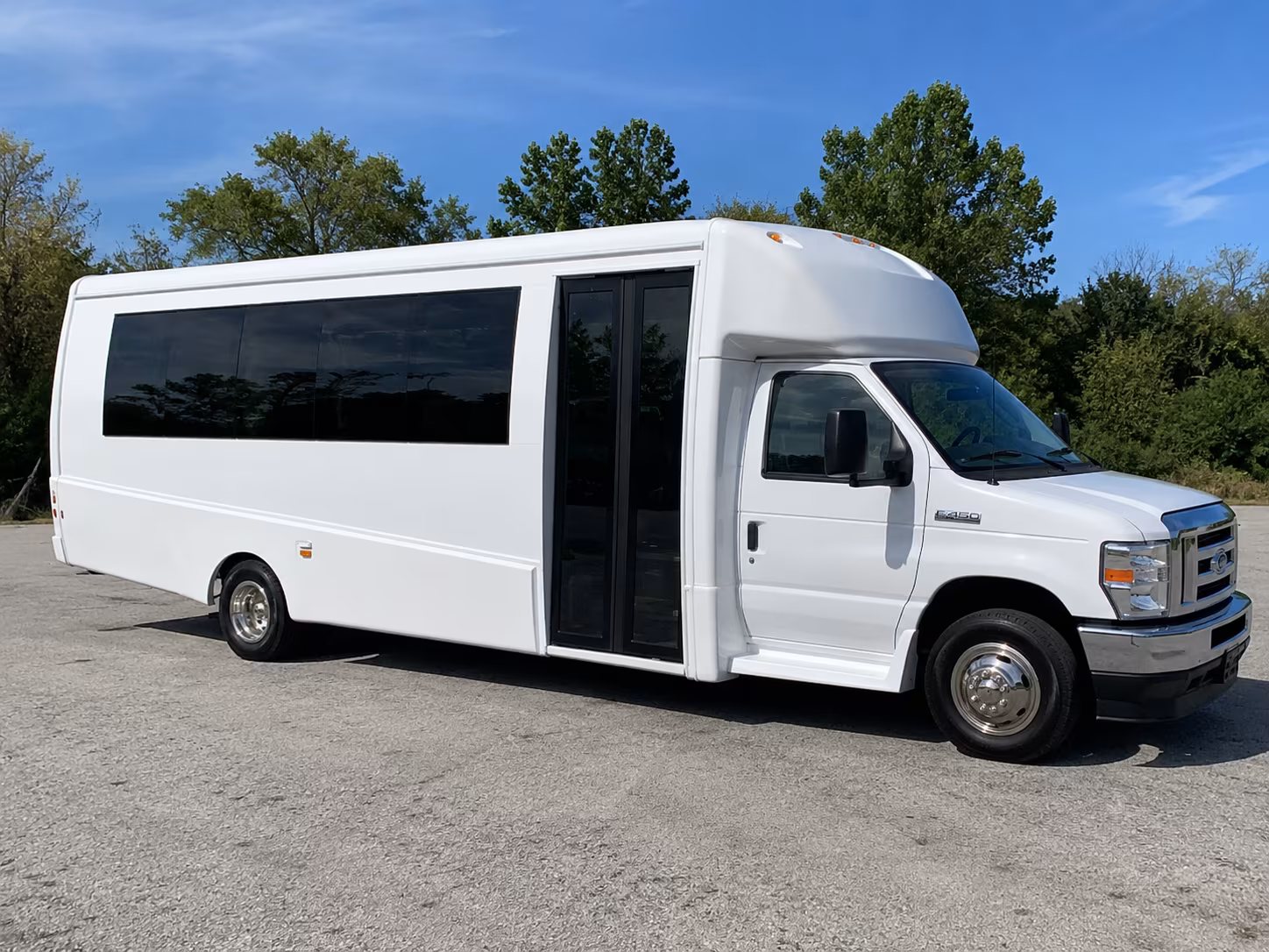 Group beside a Mercedes Sprinter limo in Miami Gardens